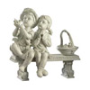 Seated Boy And Girl Statue